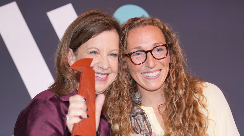 Virginia Evans, right, and Lyse Doucet winners of The Women's Prize for fiction and nonfiction, left, pose for a photograph at the 2026 Women's Prize Trust Summer Party & Awards Ceremony in London, Thursday, June 11, 2026. (AP Photo/Kin Cheung)