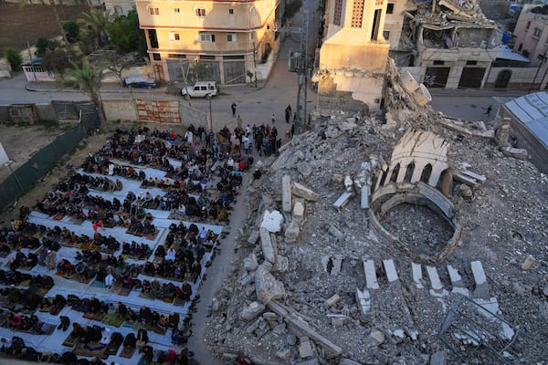 Palestinians attend Eid al-Fitr prayer in Deir al-Balah, Gaza Strip , Sunday, March 30, 2025. (AP Photo/Abdel Kareem Hana)