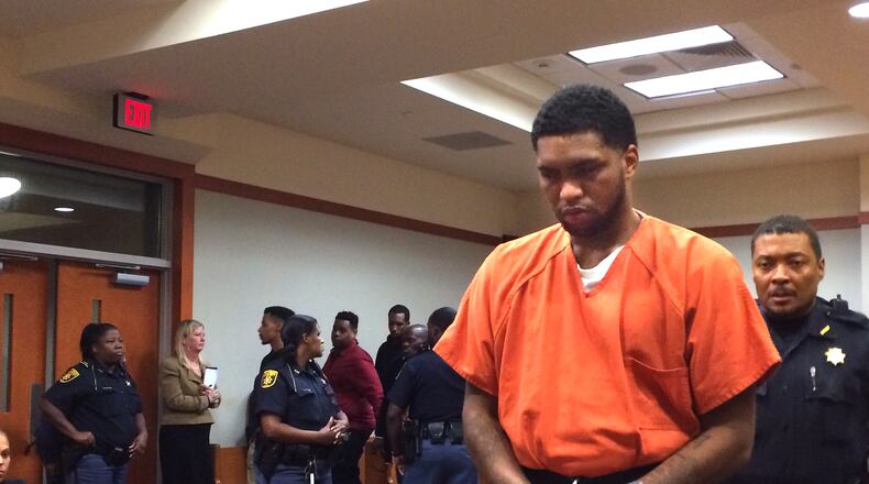 Taiquan Mitchell, who fled the state last week during his murder trial, leaves court Tuesday morning after being sentenced to life plus 40 years in prison. JOSHUA SHARPE/JOSHUA.SHARPE@AJC.COM