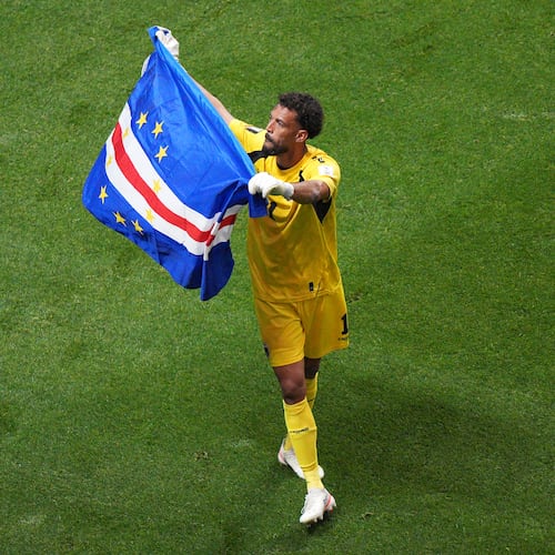 Cape Verde goalkeeper Vozinha (1) waves a flag for fans after a 0-0 draw during the World Cup Group H soccer match between Spain and Cape Verde in Atlanta, Monday, June 15, 2026. (AP Photo/Jacob Kupferman)