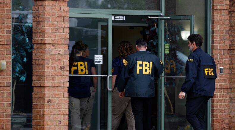 FBI personal enter the building in Portsmouth, Va., Wednesday, May 6, 2026. (Peter Casey/The Virginian-Pilot via AP)