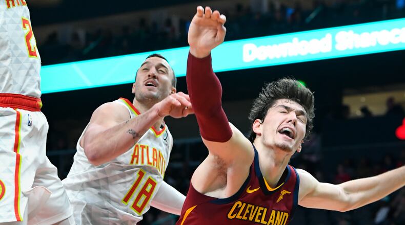 Cleveland Cavaliers forward Cedi Osman (16) reacts after being fouled while shooting against the Atlanta Hawks during the first half of an NBA basketball game, Saturday, Dec. 29, 2018, in Atlanta. (AP Photo/John Amis)