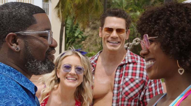 (From left) Lil Rel Howery as Marcus, Meredith Hagner as Kyla, John Cena as Ron and Yvonne Orji as Emily in 20th Century Studios’ "Vacation Friends," exclusively on Hulu. Photo courtesy of 20th Century Studios.