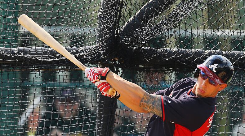 Braves outfielder Jordan Schafer connects on a pitch while facing pitchers Kris Medlen and Craig Kimbrel back to back during spring training on Sunday, Feb. 23, 2014, in Lake Buena Vista, FL. CURTIS COMPTON / CCOMPTON@AJC.COM
