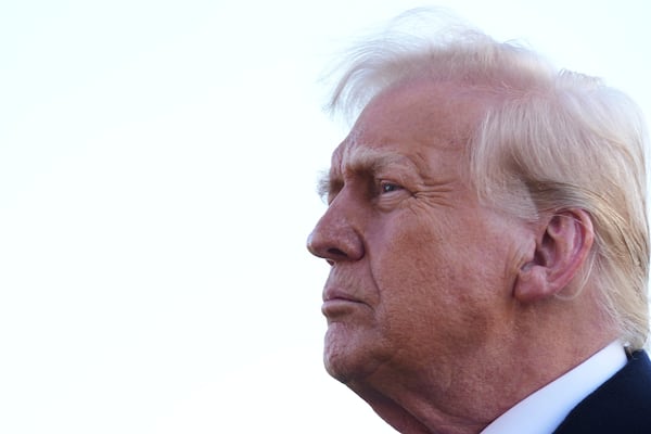 President Donald Trump speaks with reporters before departing the White House, Friday, March 21, 2025, in Washington, en route to New Jersey. (AP Photo/Jacquelyn Martin)
