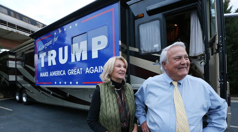 Georgia Public Service Commissioner Lauren "Bubba" McDonald, Jr., a Donald Trump supporter, and his wife Shelley speak to a reporter after arriving in their recreational vehicle at the Corey Center for a watch party on Monday, March 1, 2016, Atlanta. Curtis Compton / ccompton@ajc.com
