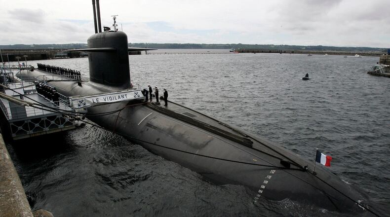 FILE - In this July 13, 2007 file photo, French Marine officers wait atop "Le Vigilant" nuclear submarine at L'Ile Longue military base, near Brest, Brittany. (AP Photo/Francois Mori, Pool, File)