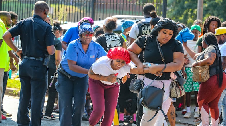 Friends and family members reacted to the news after an Atlanta mother was shot to death, Aug. 24,2021 during a domestic argument at a southeast Atlanta apartment complex. (John Spink / John.Spink@ajc.com)