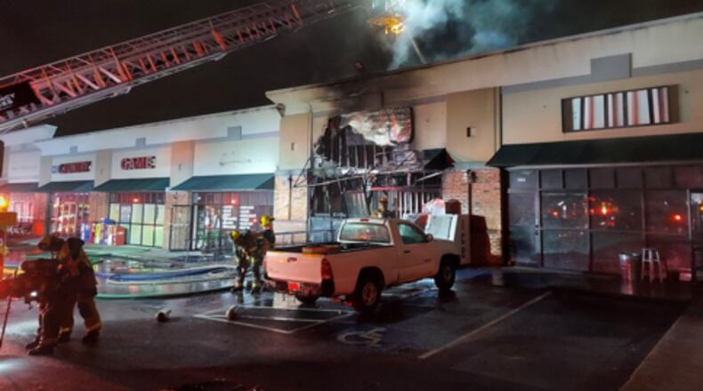 The blaze gutted the business at the Norcross strip mall.