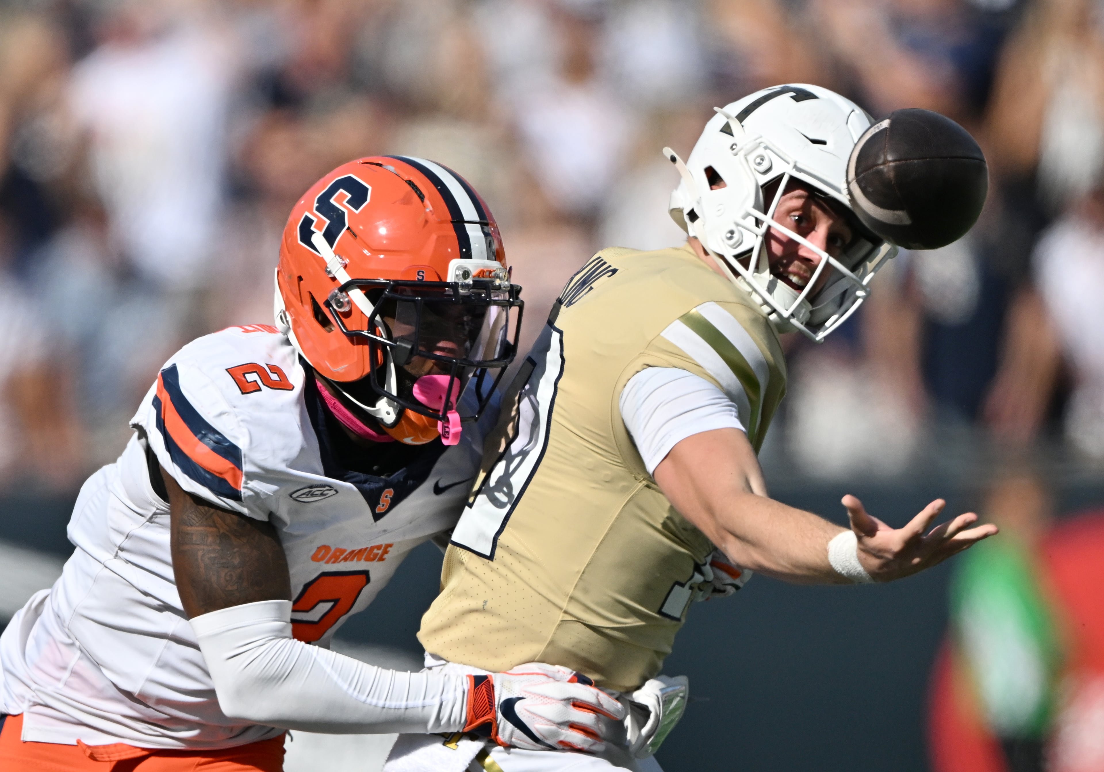 Georgia Tech quarterback Haynes King fumbles after getting a hit by Syracuse cornerback Duce Chestnut during the second half in an NCAA college football game at Bobby Dodd Stadium, Saturday, Oct. 25, 2025 in Atlanta. Georgia Tech won 41-16 over Syracuse. The Yellow Jackets are 8-0 for the first time since 1966 and 5-0 in the ACC for the first time ever. (Hyosub Shin/AJC)
