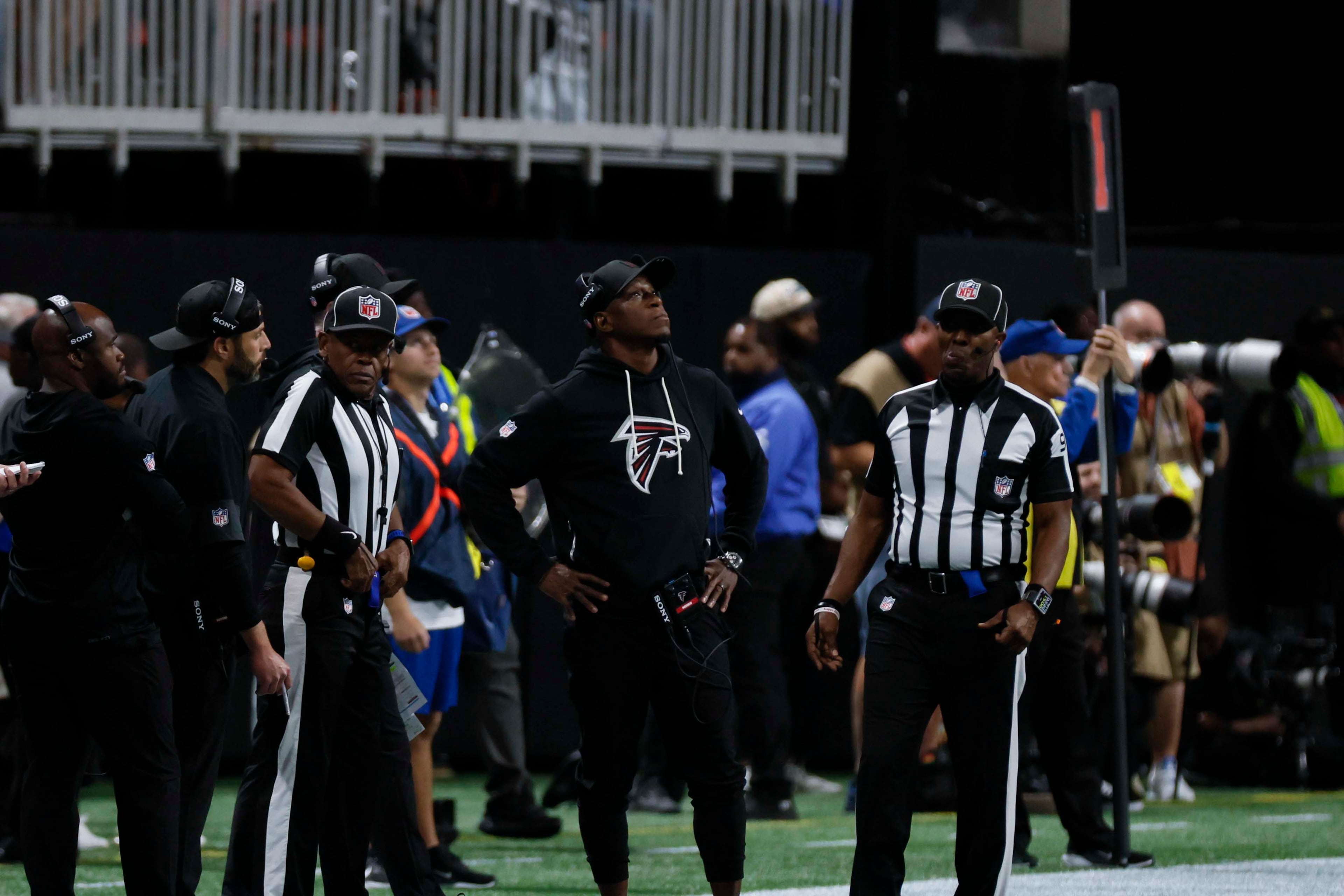 Atlanta Falcons head coach Raheem Morris looks at the jumbotron after he calls a challenge during the first half of an NFL football game against the Miami Dolphins at Mercedes-Benz Stadium in Atlanta on Sunday, Oct. 26, 2025. (Miguel Martinez/AJC)
