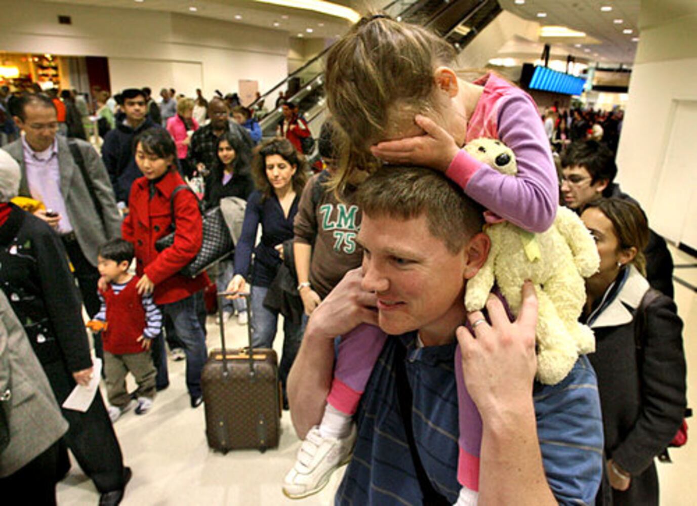 Airport lines moving as travelers scurry home