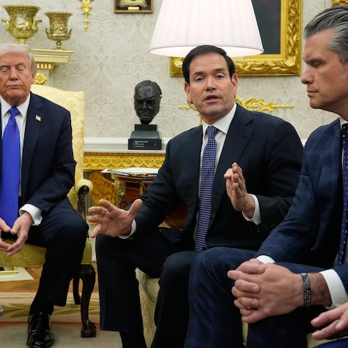 President Donald Trump and Defense Secretary Pete Hegseth listen as Secretary of State Marco Rubio speaks during a meeting with NATO Secretary General Mark Rutte in the Oval Office of the White House, Wednesday, Oct. 22, 2025, in Washington. (AP Photo/Alex Brandon)