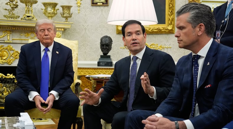 President Donald Trump and Defense Secretary Pete Hegseth listen as Secretary of State Marco Rubio speaks during a meeting with NATO Secretary General Mark Rutte in the Oval Office of the White House, Wednesday, Oct. 22, 2025, in Washington. (AP Photo/Alex Brandon)