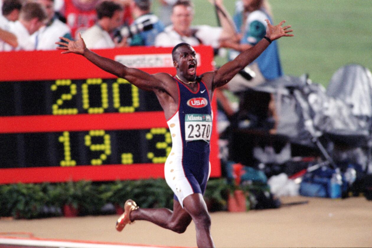 The one-word headline said "WHOOOOOOSH!," above this photo in 1996. Wearing golden shoes, Michael Johnson reacts as he realizes he has set a world record in the 200-meter event during the 1996 Summer Olympics in Atlanta. (AJC Staff Photo/Jonathan Newton)