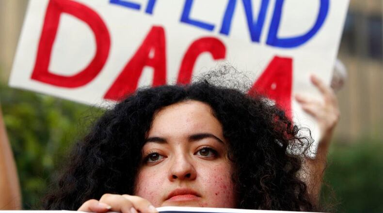FILE - In this Sept. 1, 2017 file photo, Loyola Marymount University student and dreamer Maria Carolina Gomez joins a rally in support of the Deferred Action for Childhood Arrivals, or DACA program, outside the Edward Roybal Federal Building in Los Angeles. California Attorney General Xavier Becerra filed a lawsuit Monday, Sept. 11, against the Trump administration over its decision to end a program that protects young immigrants from deportation who were brought to the U.S. illegally as children or by parents who overstayed visas. (AP Photo/Damian Dovarganes, File)