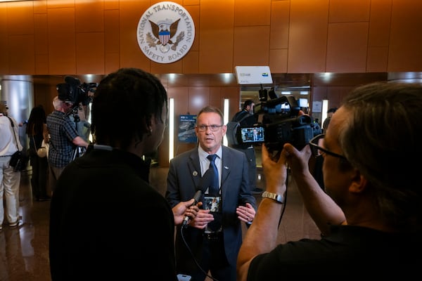 Tim Lilley speaks to media on the first day of the NTSB hearing on the Jan. 29 mid-air collision in Washington, D.C. on July 30, 2025. Lilley has done many media interviews since the crash, speaking simultaneously as a grieving father, Army veteran and experienced helicopter and aircraft pilot. (Craig Hudson for the AJC)