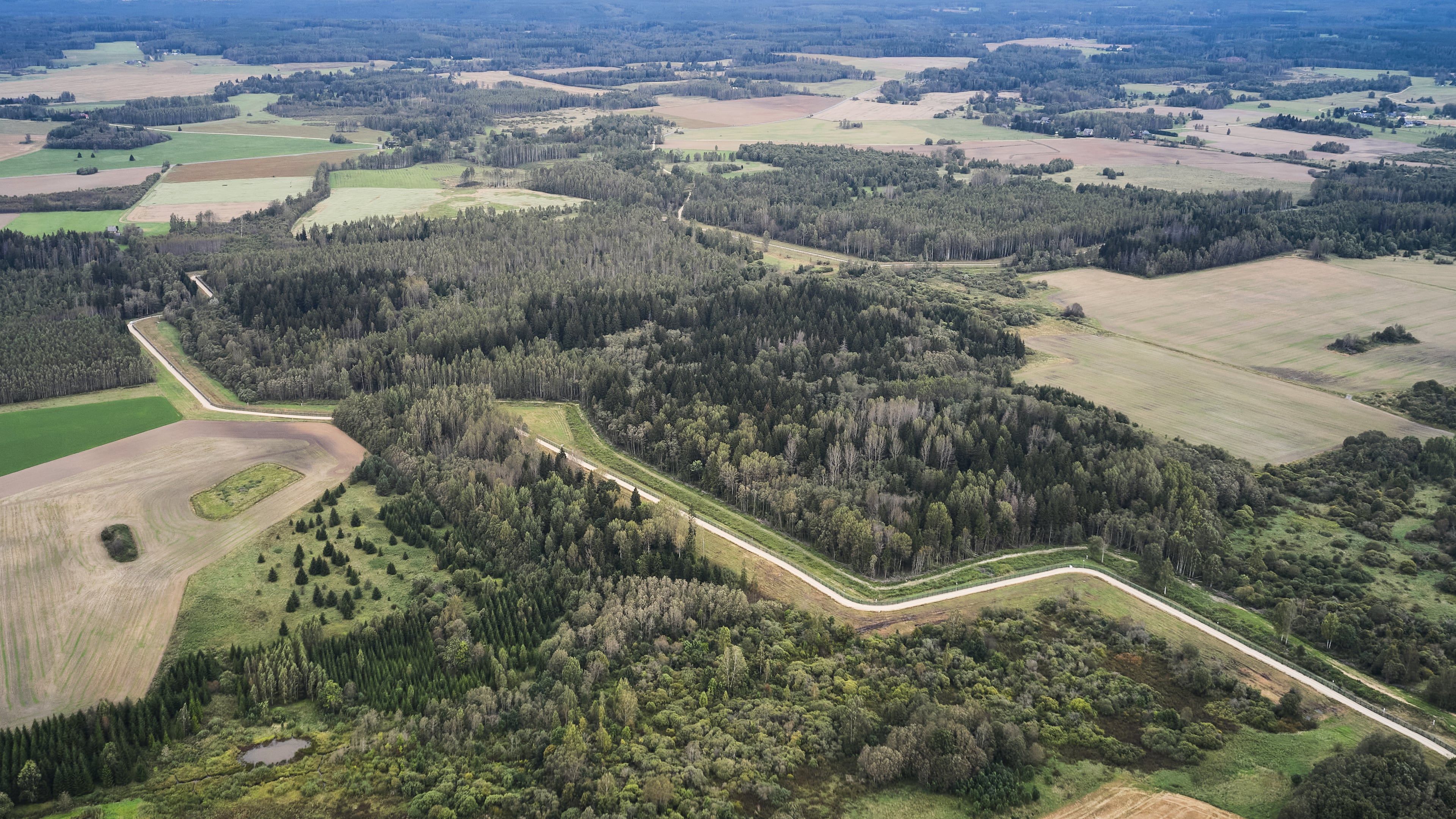 A drone shows an aerial view of the Estonia-Russia border near Vinski, Estonia, Monday, Sept. 15, 2025. (AP Photo/Hendrik Osula)