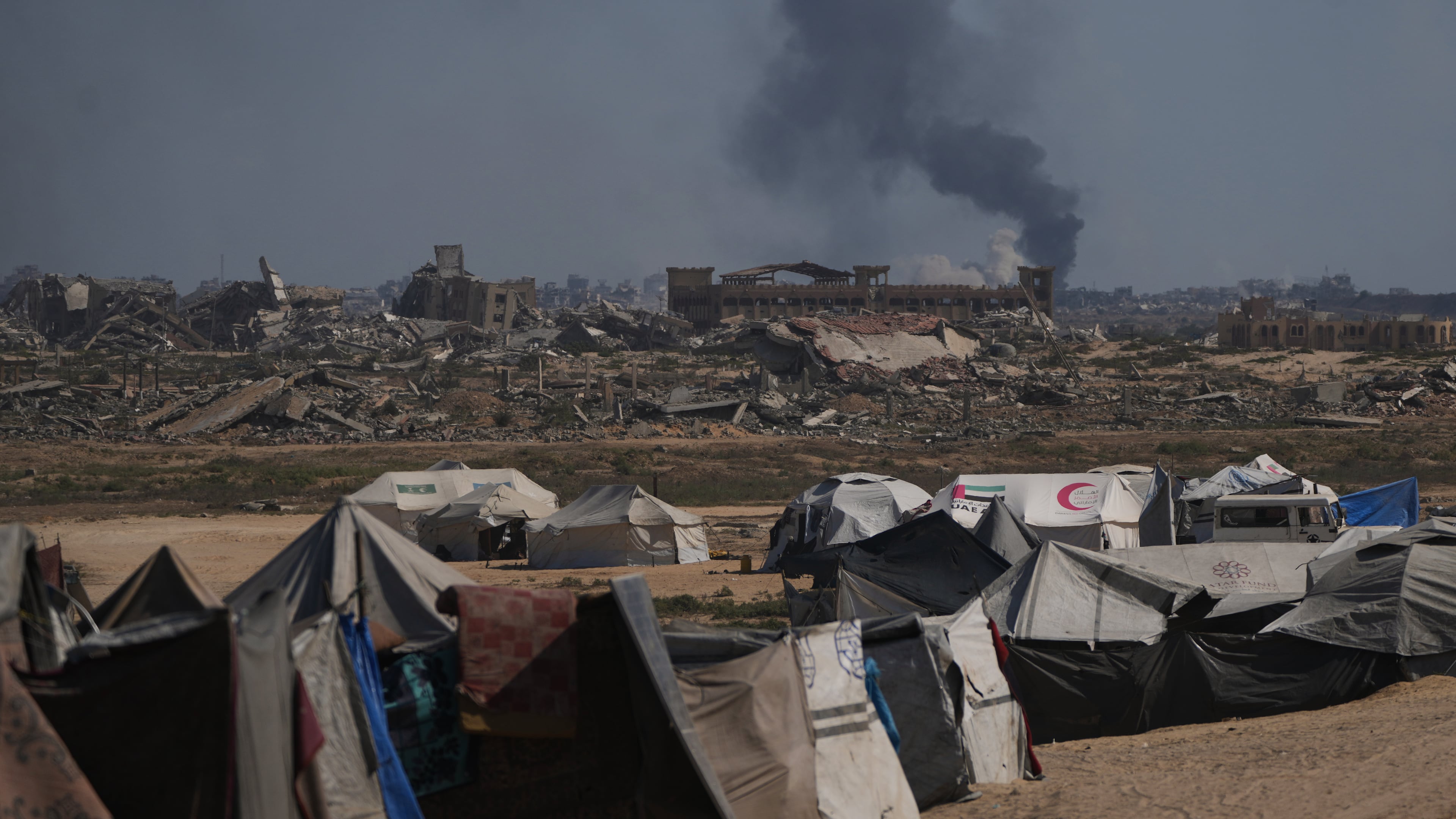 Smoke rises to the sky following an Israeli military strike in Gaza City, as seen from the central Gaza Strip, Thursday, Oct. 2, 2025. (AP Photo/Abdel Kareem Hana)