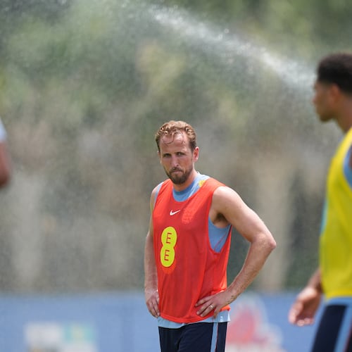 England forward Harry Kane stands near sprinklers during a training session for the national soccer team in Palm Beach Gardens, Fla., Tuesday, June 2, 2026, ahead of the World Cup soccer tournament. (AP Photo/Rebecca Blackwell)
