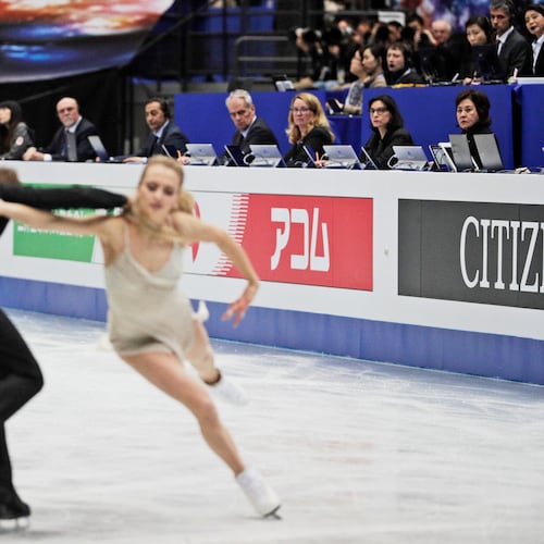 FILE - Judges watch Russia's Victoria Sinitsina and Nikita Katsalapov perform their ice dance free dance during the ISU World Figure Skating Championships at Saitama Super Arena in Saitama, north of Tokyo, March 23, 2019. (AP Photo/Andy Wong, File)