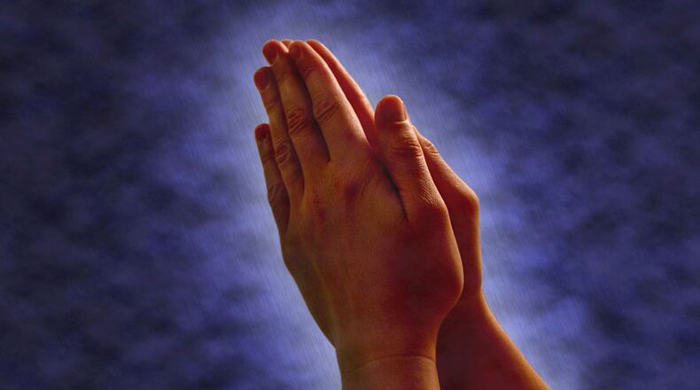 File photo of praying hands