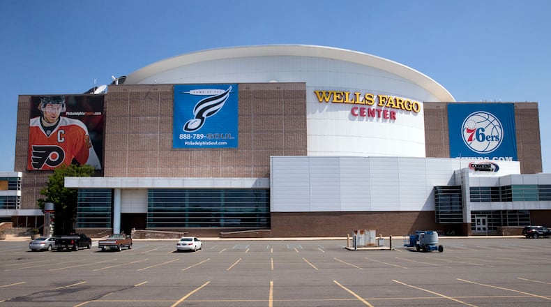 FILE - In this June 22, 2016, file photo, the Wells Fargo Center is photographed ahead of the the 2016 Democratic National Convention in Philadelphia. When Hillary Clinton hosts her party at the DNC, she’ll face the issue of how to squeeze in the many popular, prominent Democrats backing her campaign. (AP Photo/Matt Rourke, File)