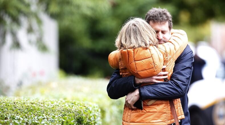 Residents embrace after a mass shooting left at least 10 dead at the Tree of Life synagogue in Pittsburgh’s Squirrel Hill neighborhood, Oct. 27, 2018. (Jared Wickerham/The New York Times)