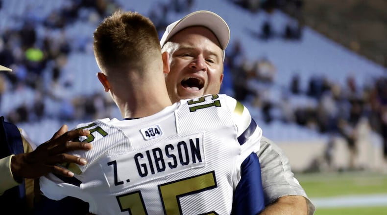 Georgia Tech interim head coach Brent Key, right, celebrates with quarterback Zach Gibson (15) after the team upset North Carolina in an NCAA college football game, Saturday, Nov. 19, 2022, in Chapel Hill, N.C. (AP Photo/Chris Seward)