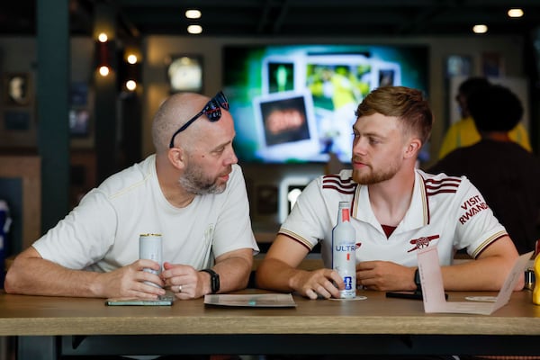 (From left) Matthew Musk and his son Alex Musk, from England, enjoy a drink at the Brewhouse pub in South Downtown Atlanta as they just arrived in town for the World Cup round of 32 match between England and RD Congo on Monday, June 29, 2026. The Musks believe they can beat DR Congo, but they are not very optimistic about their team moving forward to the next rounds. (Miguel Martinez/AJC)