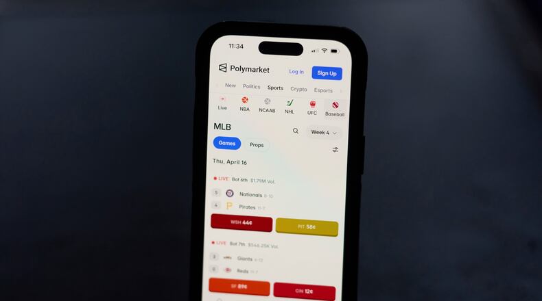 A phone displays sports trades on Polymarket on Thursday, April 16, 2026, in Portland, Ore. (AP Photo/Jenny Kane)