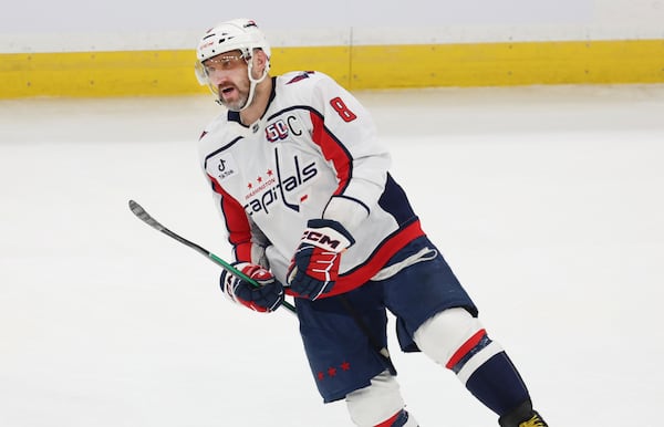 Washington Capitals left wing Alex Ovechkin (8) reacts after scoring a goal during the first period of an NHL hockey game against the Boston Bruins, Tuesday, April 1, 2025, in Boston. (AP Photo/Mark Stockwell)