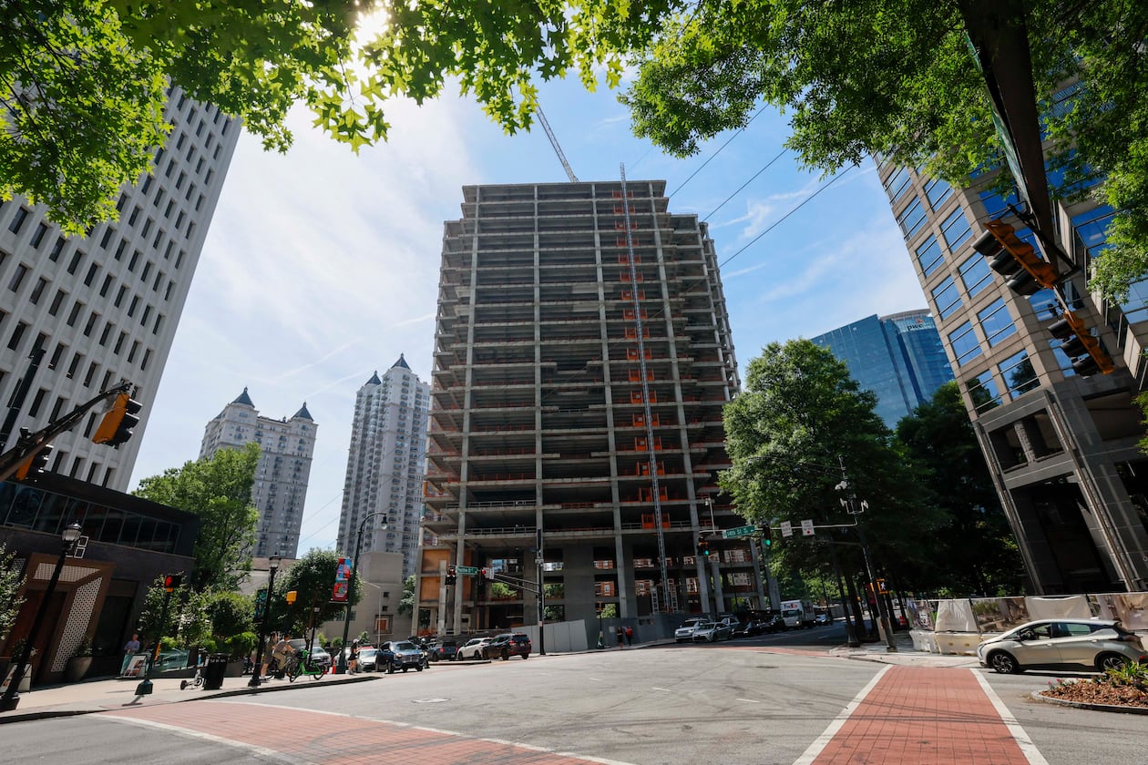 The Campanile building, a well-known Midtown construction site, has remained incomplete for years. Local residents are unhappy with the slow progress, and some city officials have taken notice. (Miguel Martinez/AJC)