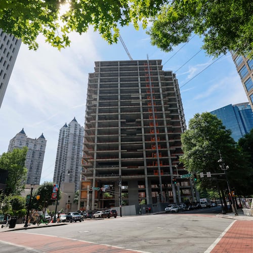 The Campanile building, a well-known Midtown construction site, has remained incomplete for years. Local residents are unhappy with the slow progress, and some city officials have taken notice. (Miguel Martinez/AJC)