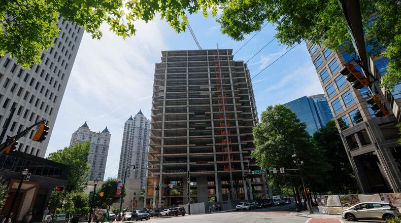 The Campanile building, a well-known Midtown construction site, has remained incomplete for years. Local residents are unhappy with the slow progress, and some city officials have taken notice. (Miguel Martinez/AJC)