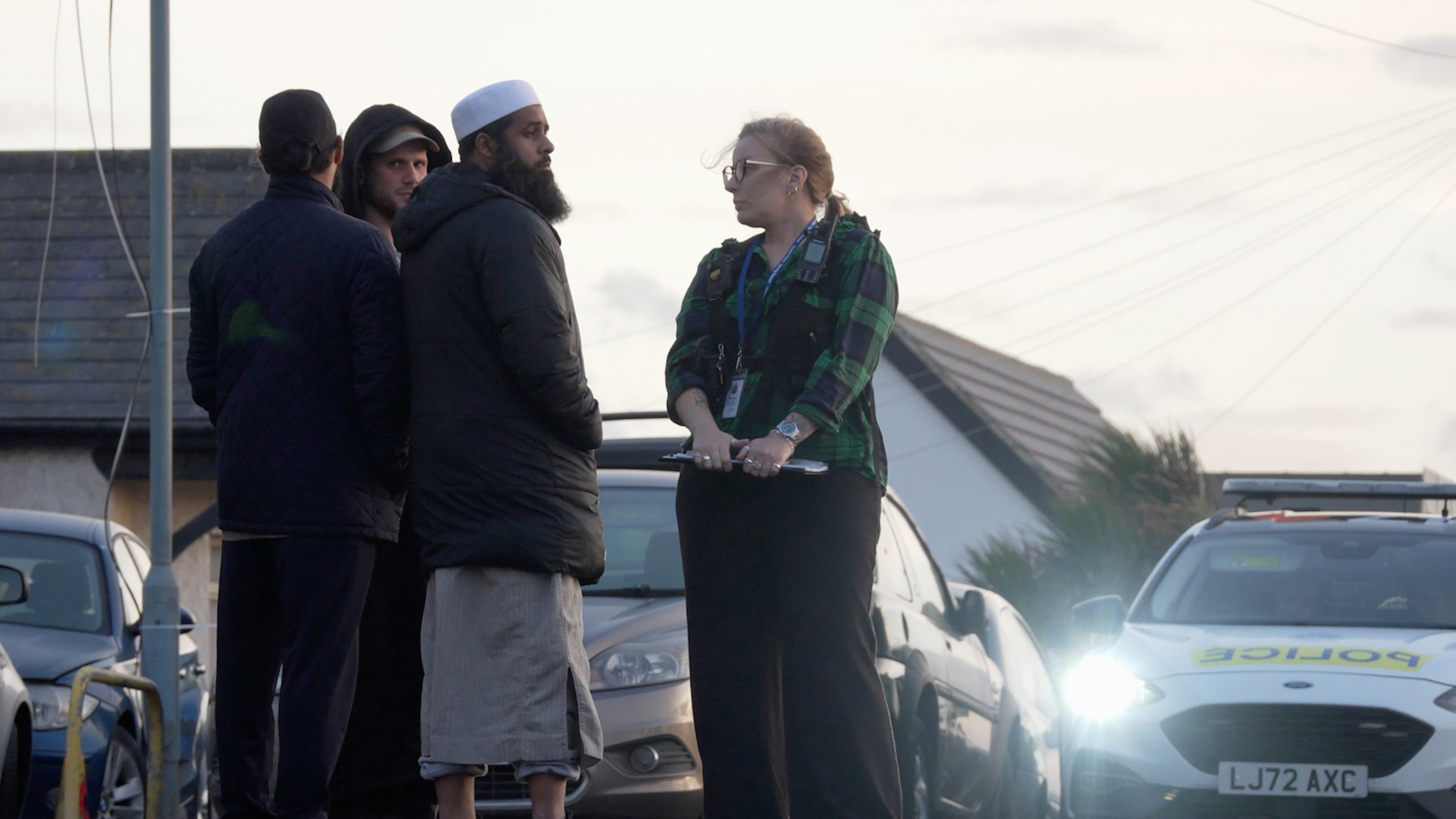 Locals view the damage outside the front entrance of the mosque in Peacehaven, following a suspected arson attack, in East Sussex, England, Sunday, Oct. 5, 2025. (Jamie Lashmar/PA via AP)