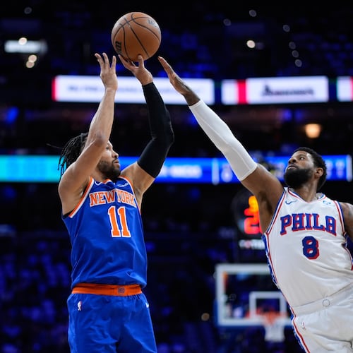 FILE - New York Knicks' Jalen Brunson, left, goes up for a shot against Philadelphia 76ers' Paul George during the first half of Game 4 in a second-round NBA basketball playoffs series, May 10, 2026, in Philadelphia. (AP Photo/Matt Slocum, File)