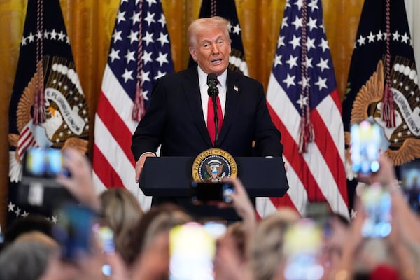 FILE - President Donald Trump speaks at a reception celebrating Women's History Month in the East Room of the White House, Wednesday, March 26, 2025, in Washington. (AP Photo/Mark Schiefelbein, File)
