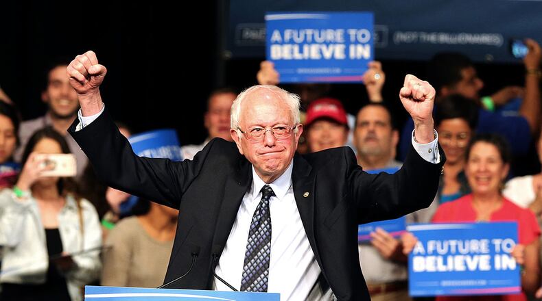 Democratic presidential candidate Sen. Bernie Sanders acknowledges his supporters during a campaign event in Miami at the James L. Knight Center on Tuesday. Pedro Portal / El Nuevo Herald