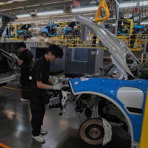 FILE - Workers assemble the Zeekr 001 EV models at the Chinese automaker Zeekr assembly plant in Ningbo, east China's Zhejiang Province, April 17, 2025. (AP Photo/Andy Wong, File)