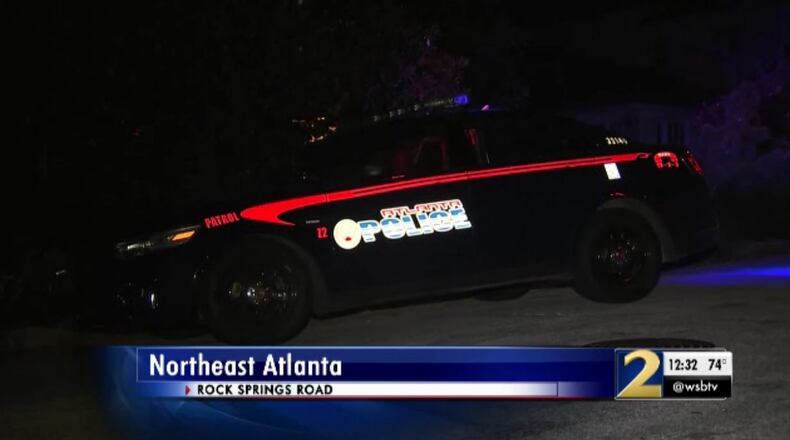 Four people with masks ambushed two men as they changed a tire in Midtown, robbed them at gunpoint and shot one of them in the abdomen, police said. (Credit: Channel 2 Action News)