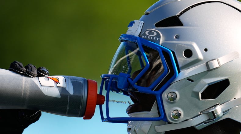 Detroit Lions running back Jabari Small drinks water to cool off from the heat during a NFL football training camp practice in Allen Park, Mich., Wednesday, July 29, 2026. (AP Photo/Paul Sancya)