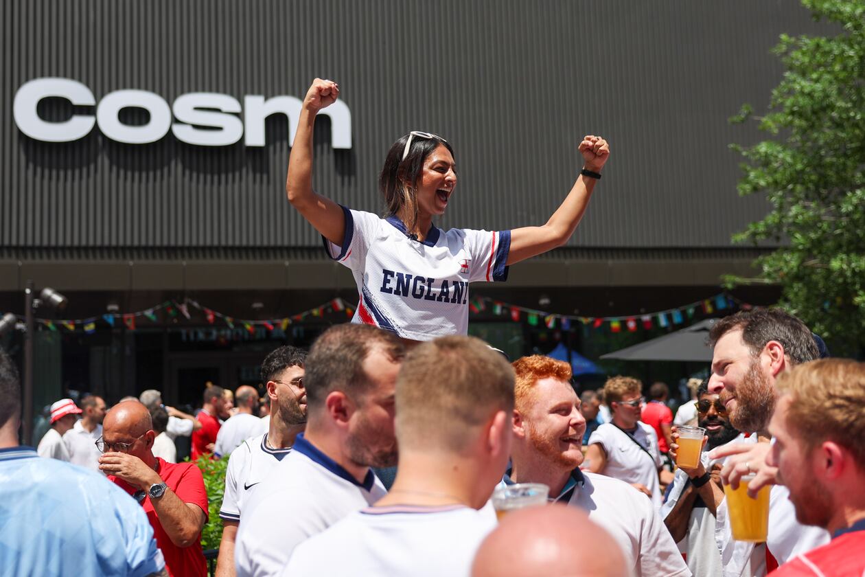 England fans, including Kajal Patel (center), celebrate at Irish Exit before the FIFA World Cup game against Argentina in Atlanta on July 15, 2026. It’s the last game Atlanta is hosting. (Arvin Temkar/AJC)