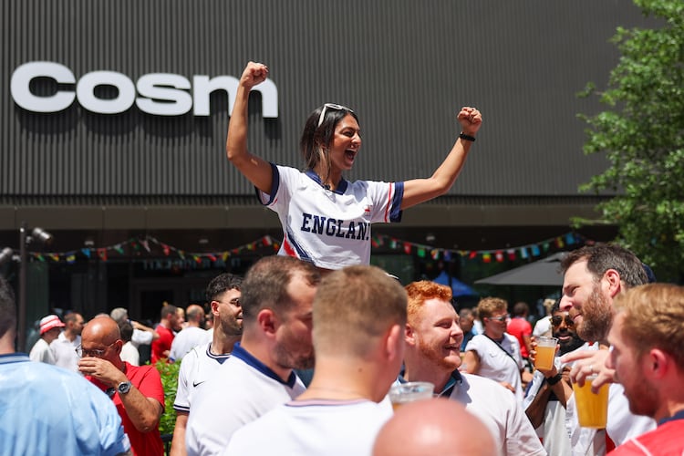 England fans, including Kajal Patel (center), celebrate at Irish Exit before the FIFA World Cup game against Argentina in Atlanta on July 15, 2026. It’s the last game Atlanta is hosting. (Arvin Temkar/AJC)