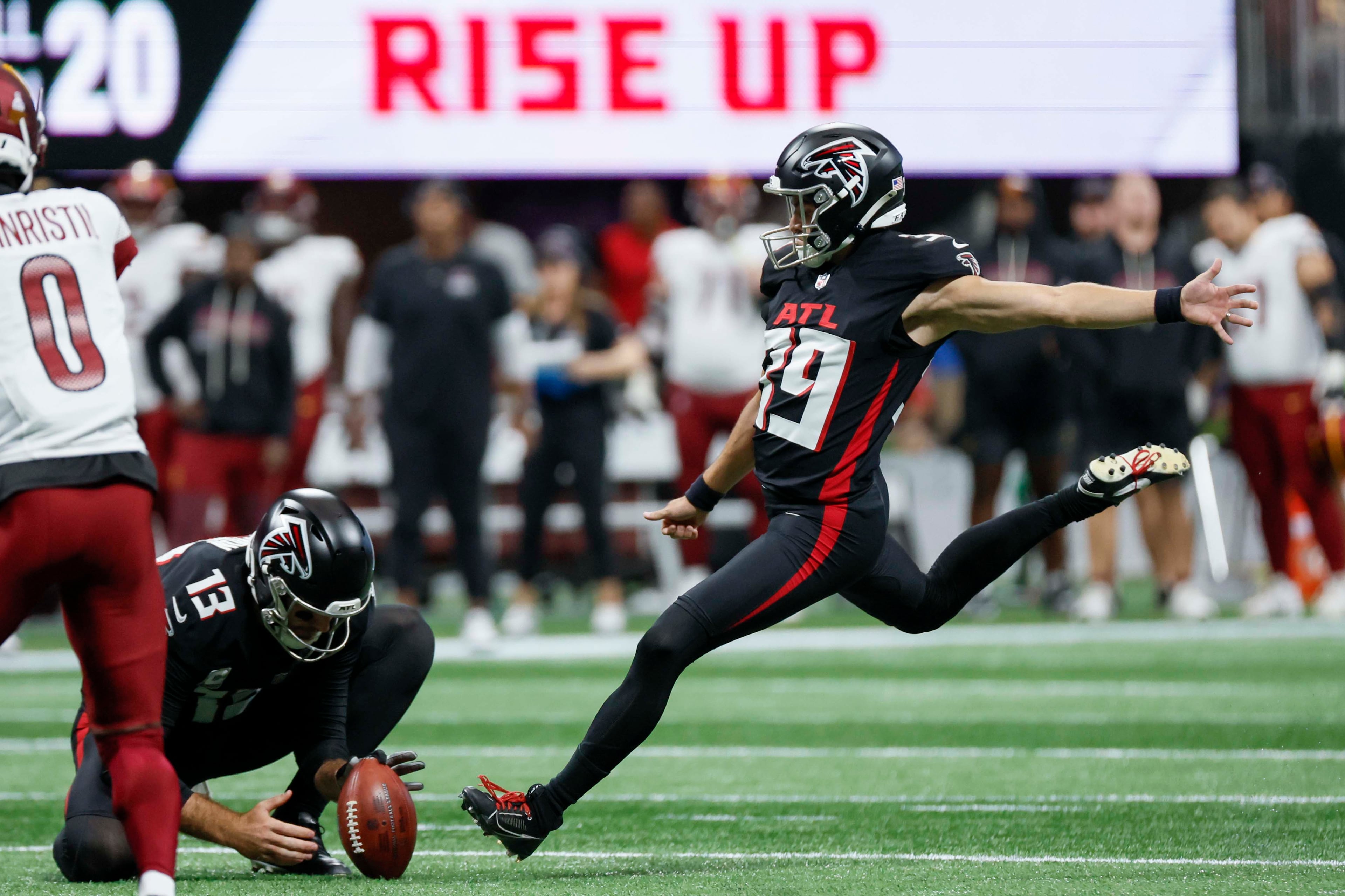 Atlanta Falcons kicker Parker Romo kicks a field goal during the first half of an NFL game against the Washington Commanders at Mercedes-Benz Stadium in Atlanta on Sunday, September 28, 2025. (Miguel Martinez/AJC)