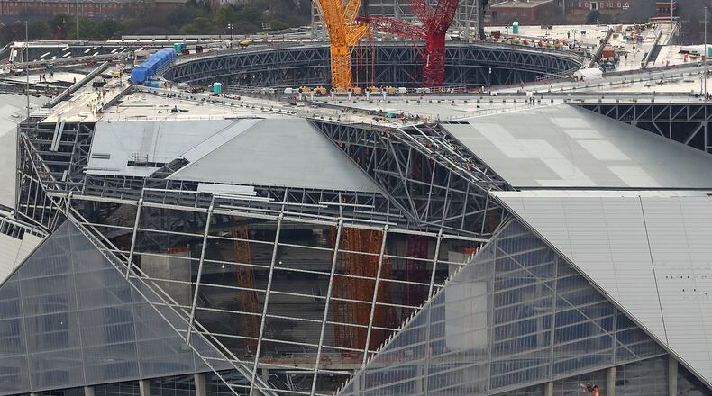 January 10, 2017, Atlanta: The progress of the new Falcons Mercedes-Benz Stadium is seen with cranes rising from the floor through the retractable roof on Tuesday, Jan. 10, 2017, in Atlanta. Curtis Compton/ccompton@ajc.com