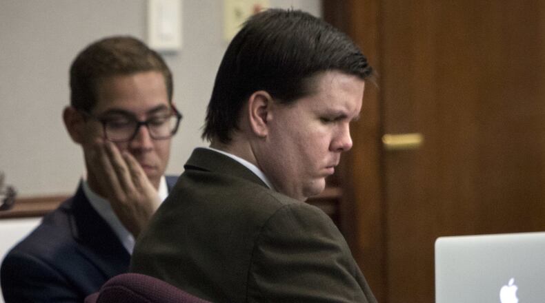 A downcast Justin Ross Harris listens to Cobb County Senior Assistant District Attorney Chuck Boring’s opening statement on Monday. (Stephen B. Morton / The Atlanta Journal-Constitution)