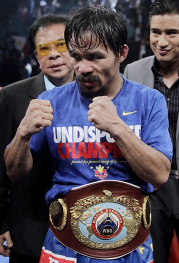 Manny Pacquiao defeats Juan Manuel Marquez