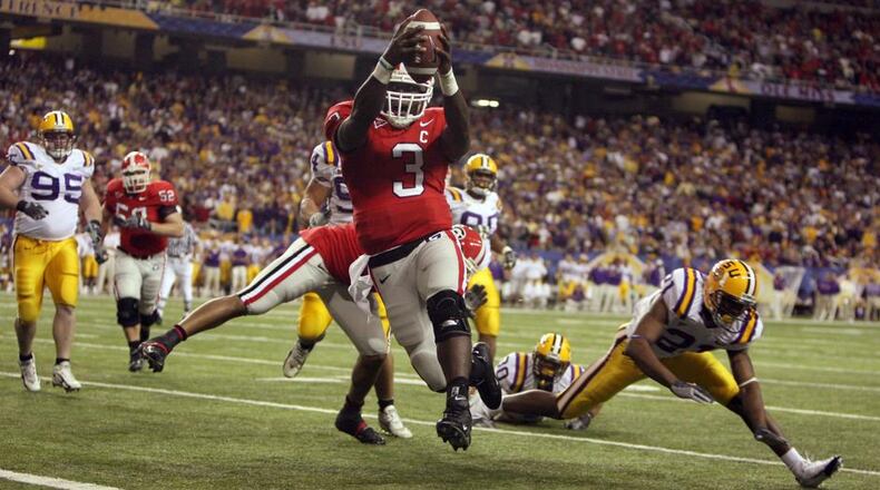UGA quarterback D.J. Shockley (3) runs into the end zone for a score in 2005. Brant Sanderlin/AJC Staff