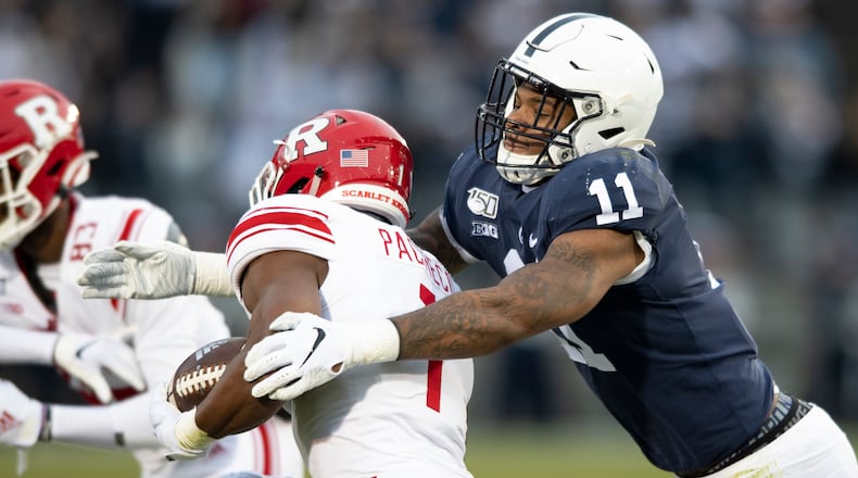 Penn State linebacker Micah Parsons (11) tackles Rutgers tight end Johnathan Lewis (11) in the first quarter Nov. 30, 2019, in State College, Pa. Penn State All-American Micah Parsons is opting out of the 2020 season because of concerns about COVID-19. The junior linebacker made his announcement with a social media post Thursday, Aug. 6, 2020. (Barry Reeger/AP)